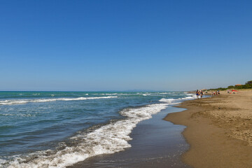 The sandy beach of San Vincenzo, a small fishing village on the Tuscan coast, popular tourist...
