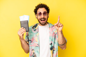 Fototapeta crazy bearded man feeling like a happy and excited genius after realizing an idea. tourist with a passport, holidays concept obraz