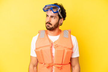 Fototapeta crazy bearded man feeling sad, upset or angry and looking to the side. life jacket concept obraz