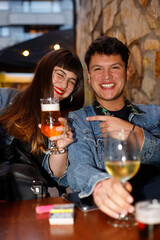 friends drinking wine in a bar happiness
