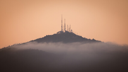 Antenna with sunset and clouds