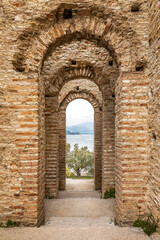 Fototapeta na wymiar The Grottoes of Catullus, an archeological excavation site of an old roman villa at the tip of Sirmione at Lake Garda, Italy.