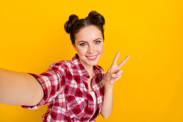 Portrait of positive lady greeting followers make v-sign selfie image isolated on bright color background