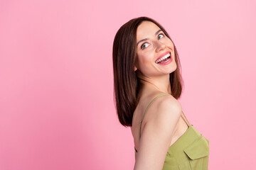 Side profile photo of adorable nice cute positive woman bob hairdo wear khaki top look empty space isolated on pink color background