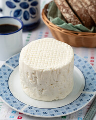Artisanal fresh white cheese from Minas Gerais, Brazil with coffee and bread