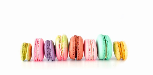 Colored macaroons on white background. Bold hues for seasonal projects and basis designs.