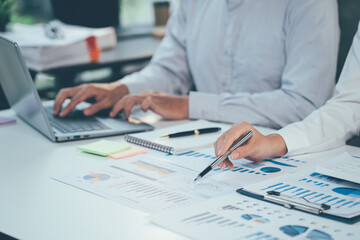 Group of business people brainstorming, analyzing and planning to work together at the meeting