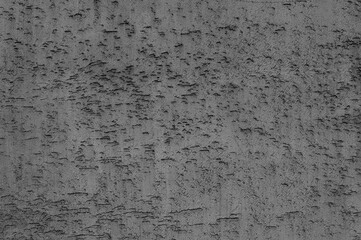 gray background. in the photo, an old gray concrete wall in close-up.