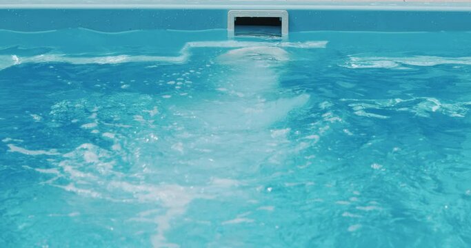 The countercurrent in the pool is a powerful flow of water. A swimmer can swim in a small pool