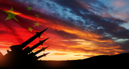 The missiles are aimed at the sky at sunset with China flag. Nuclear bomb, chemical weapons,...