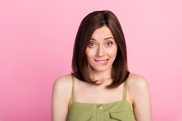 Fototapeta premium Photo of shy brunette lady bite lip wear khaki top isolated on pink color background