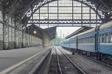 Naklejka na ściany i meble Train stands by the platform.
