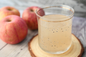 seed apple juice in a glass on table 
