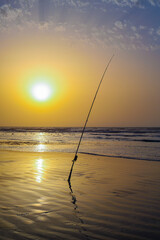 The sea,the fisher rod and a sunset in laayoune city