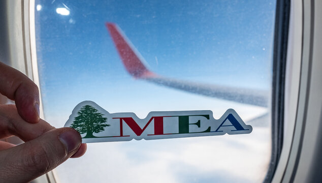 December 6, 2021, Beirut, Lebanon. The emblem of the airline Middle East Airlines on the background of the window of the aircraft.