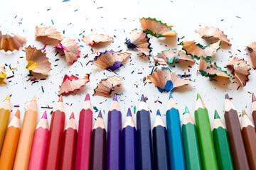 Crayons -  Color pencils isolated with pencil shavings on white background.