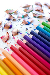 Crayons - Color pencils isolated with pencil shavings on white background.