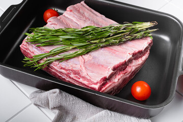 Argentinean Style Short Ribs, on white ceramic squared tile table background
