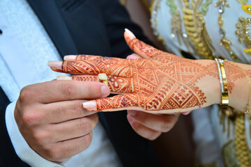 Close up of moroccon couple's hands at a wedding, concept of marriage, moroccan wedding.