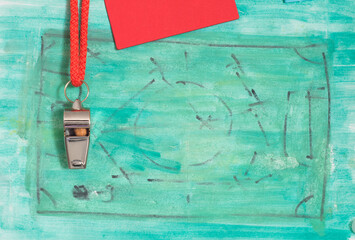 Whistle and red card of soccer referee or trainer and soccer tactics scribble. Great soccer event...