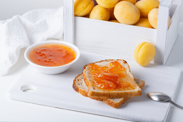 Toasts of bread with apricot jam and fresh fruits