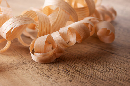 Beautiful wood shavings, on an old work desk. close-up. Shallow depth of field.