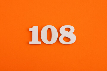 Number 108 - On orange foam rubber background - obrazy, fototapety, plakaty