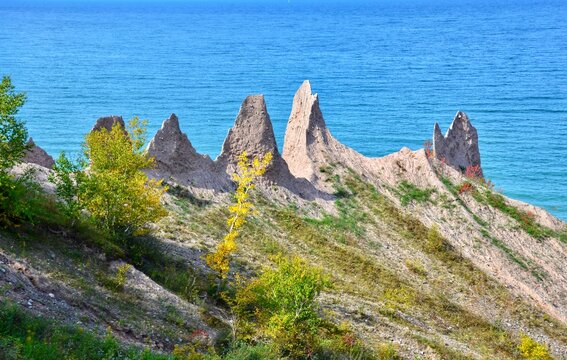 Chimney Bluffs State Park, New York. It&rsquo;s situated on the southern shore of Lake Ontario, east of Sodus Bay. From the park's hiking trails, you can view the large clay formations at the water's edge