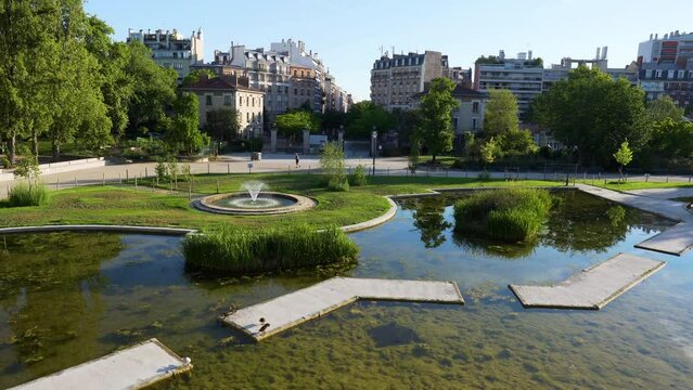 Static shot of the Garden of Renovated Georges Brassens Public Park with Fountain and runners