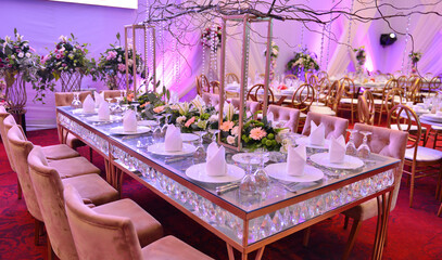 A beautiful styled table with raspberry cakes, bruschetta with figs and purple details..