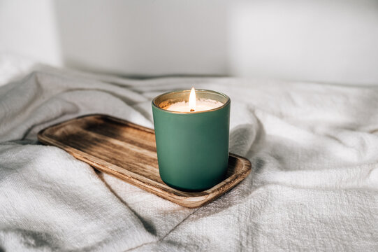 Green Candle On Wooden Plate