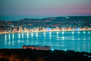 Naklejka na ściany i meble Panoramic view of Tangier at night. Tangier is a Moroccan city located in the north of Morocco in Africa..