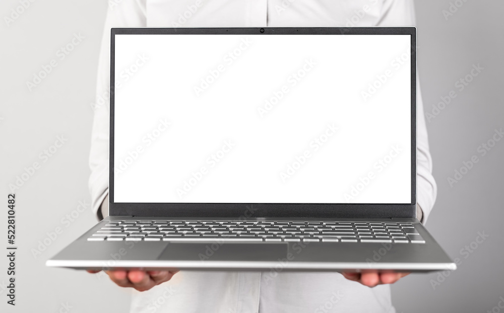 Poster Hands holding laptop mockup with empty display. Person using computer for showing presentation at work. Frontal view. High quality photo