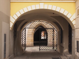 architectural details:  arches and metal door of classical buildings at the market square of Świdnica Poland