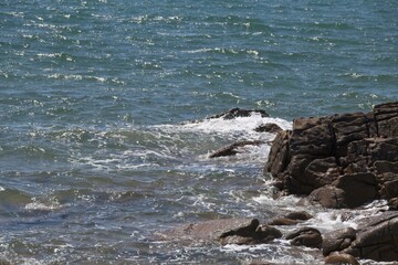 waves crashing on rocks