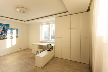 Workspace with desk and chair in modern room for children. Working table in kid's room.