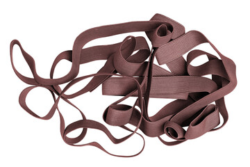 Elastic band isolated. Close-up of a pile of red brown band for sewing clothes isolated on a white...