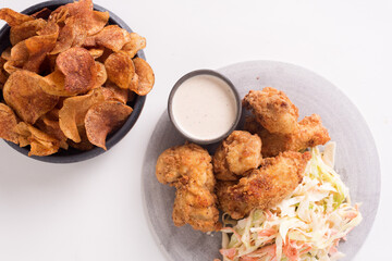 fried chicken wings with chips and coleslaw 