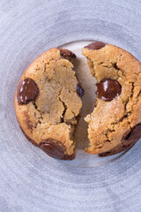 broken chocolate chip cookies forms a yin and yang shape 