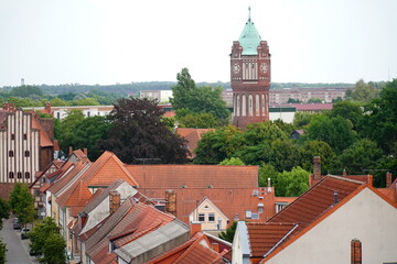 View over the red roofs of the historic old town of Salzwedel. In background the Water tower from...