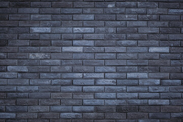 Dark grey brick tiles wall texture background. Backdrop for design.