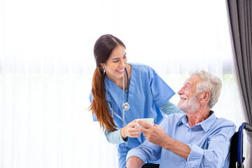 happy senior male patient health check and takecare by young female doctor or nurse at home after...