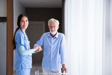 happy senior male patient health check and takecare by young female doctor or nurse at home after retirement for good health