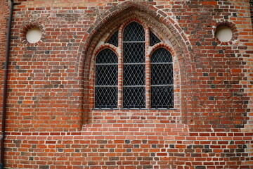 Details of a church facade in typical North German brick Gothic style. City of Salzwedel, Altmark district, state of Saxony Anhalt, Germany.