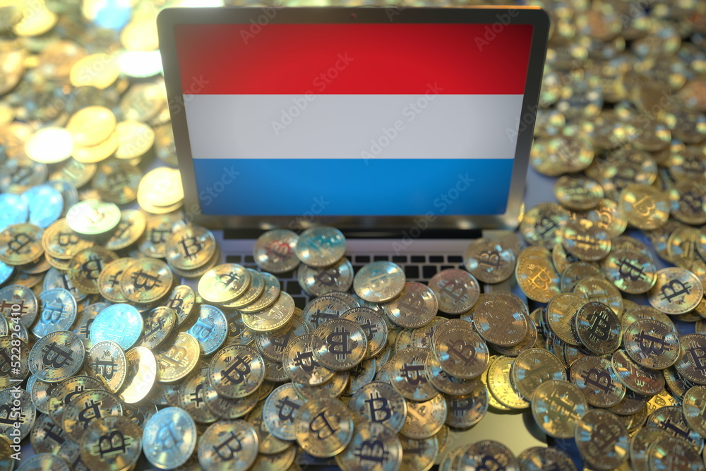 Aufkleber computer with flag of luxembourg and pile of bitcoins. national regulations and cryptocurrency minin