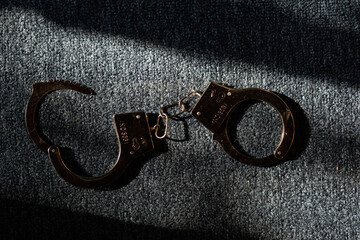 Classic chain handcuffs on black background