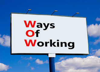 WOW ways of working symbol. Concept words WOW ways of working on white billboard against blue sky and clouds. Beautiful background. Business and WOW ways of working concept. Copy space.