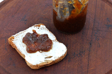 toast with cream cheese and fruit jam. Context breakfast or snack