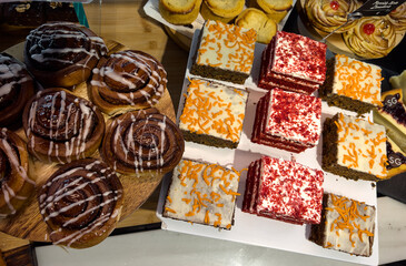 Mix of freshly baked pastries exposed in a bakary shop