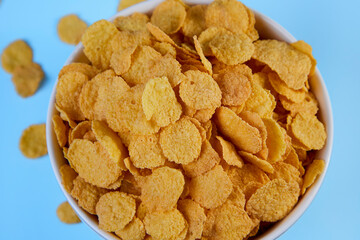 corn flakes in a shelf on a blue background top view